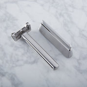 GENESIS Single Blade Safety Razor sitting next to matching stand