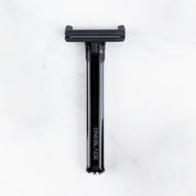 OneBlade Core Single Blade Safety Razor resting on marble surface